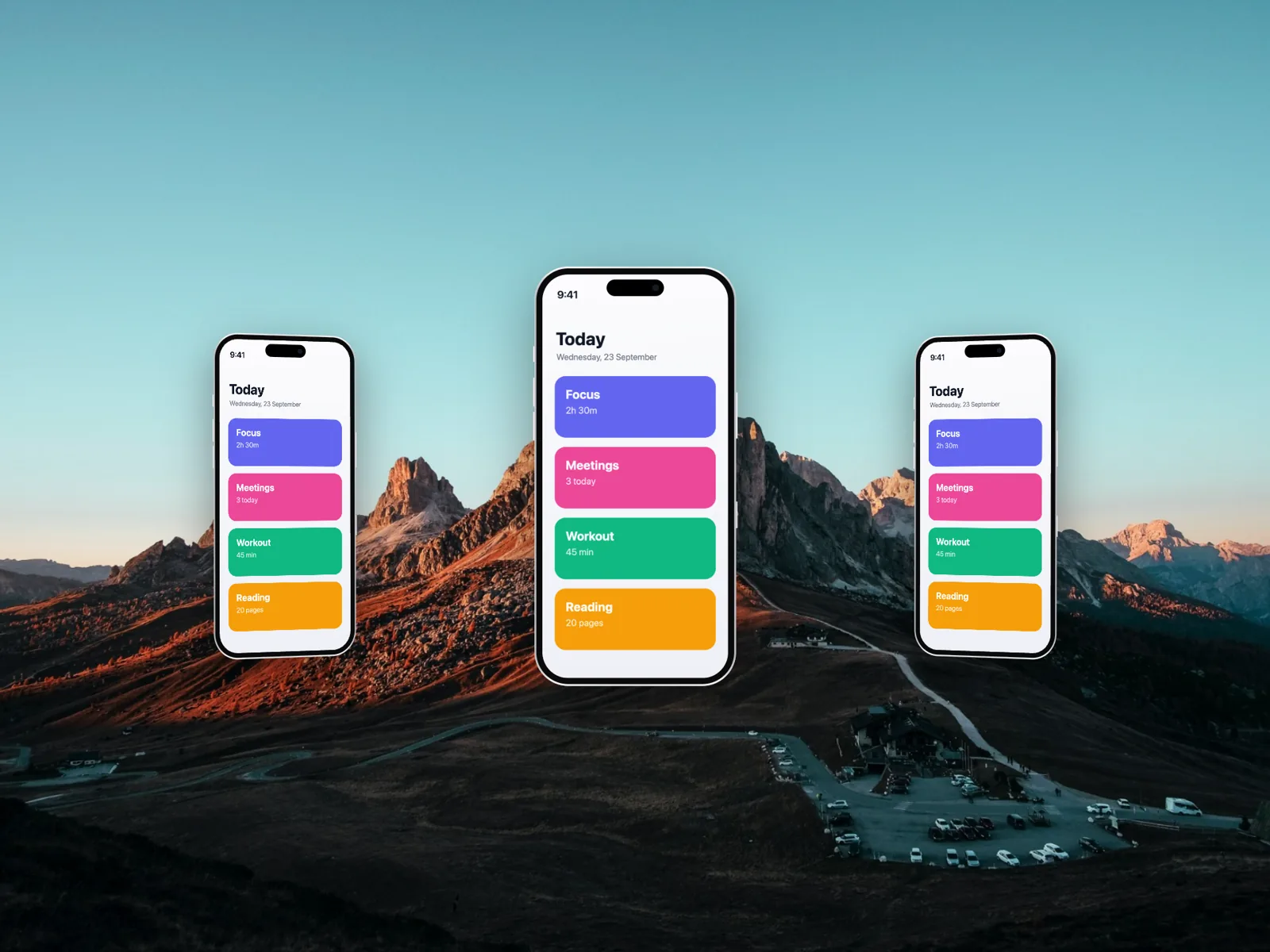 Three iPhones fanned out over mountains at sunset