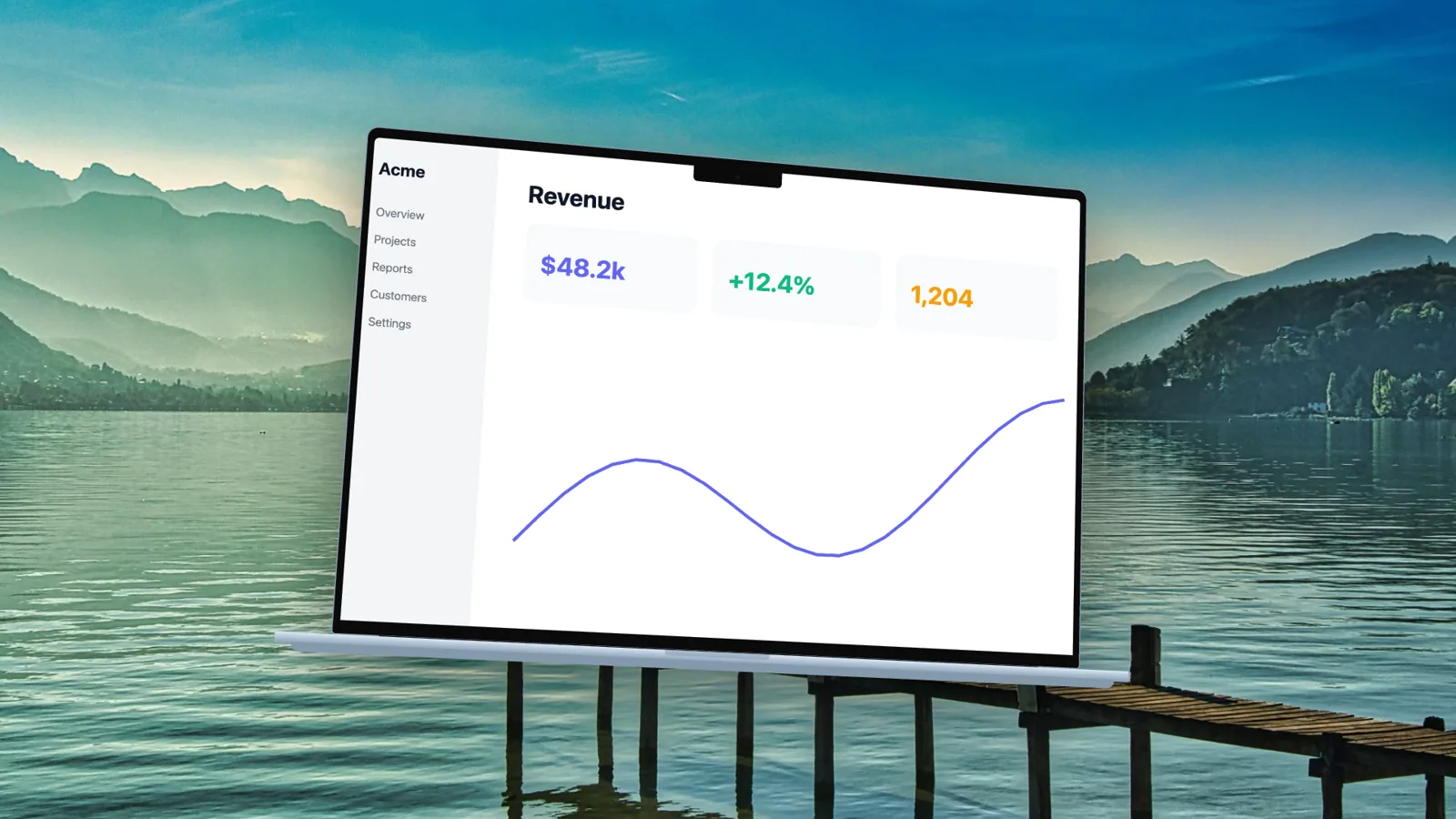 A MacBook Air mockup in front of a mountain lake